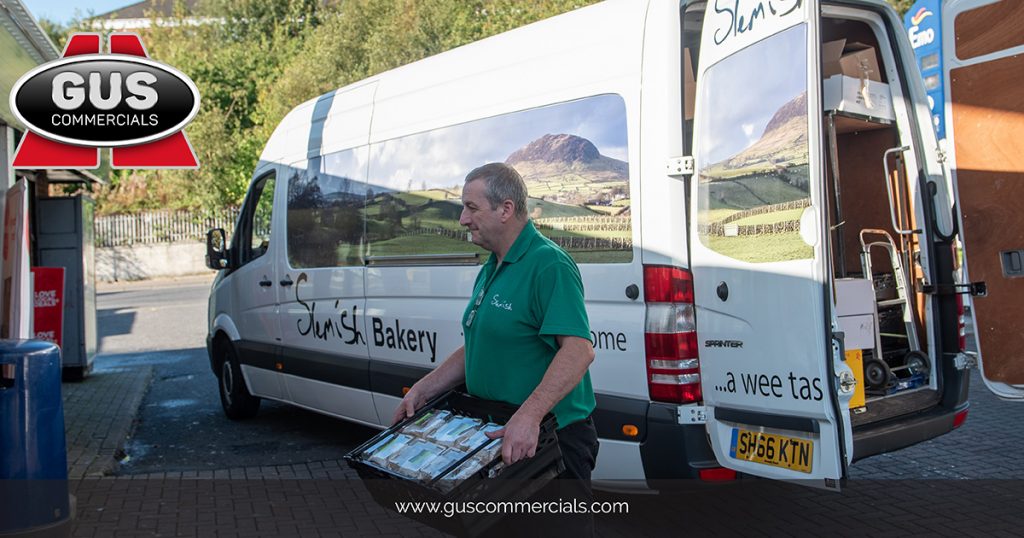 Craig Foods Delivery Driver Delivering Slemish Bakery Goods to a Store Using a Van Supplied by Gus Commercials