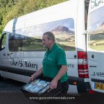 Craig Foods Delivery Driver Delivering Slemish Bakery Goods to a Store Using a Van Supplied by Gus Commercials