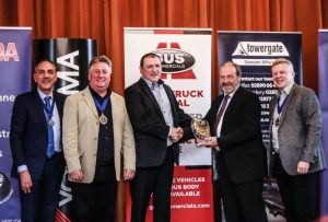 Billy Miskelly of Gus Commercials presenting the Tyre Manufacturer of the Year award to Derek Hill of Tyre Call Antrim at the 2019 National Tyre Distributors Association NI annual ceremony